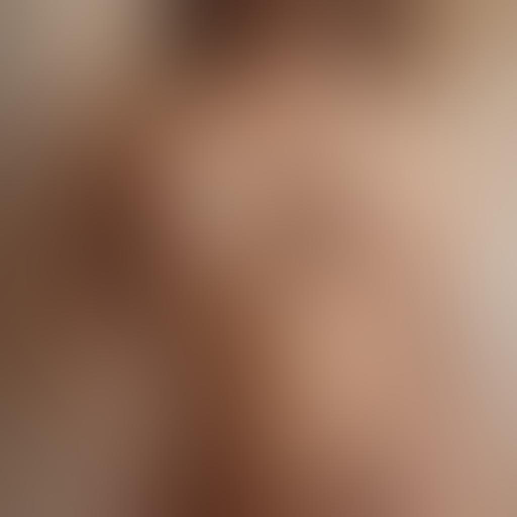 A close-up intimate portrait of a nude human figure, artistically posed, showcasing graceful lines and natural curves. Soft, diffused lighting highlights the skin's texture, creating a serene ambiance. The background is an abstract blend of warm, earthy tones that enhances the human form without distraction. Include elements that evoke emotions, such as delicate flowers or flowing fabric near the figure. super-realistic. warm colors. soft focus.